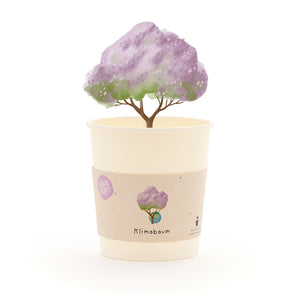 Taza con un árbol dibujado con hojas de color morado y la palabra “Climate Tree” en la etiqueta.