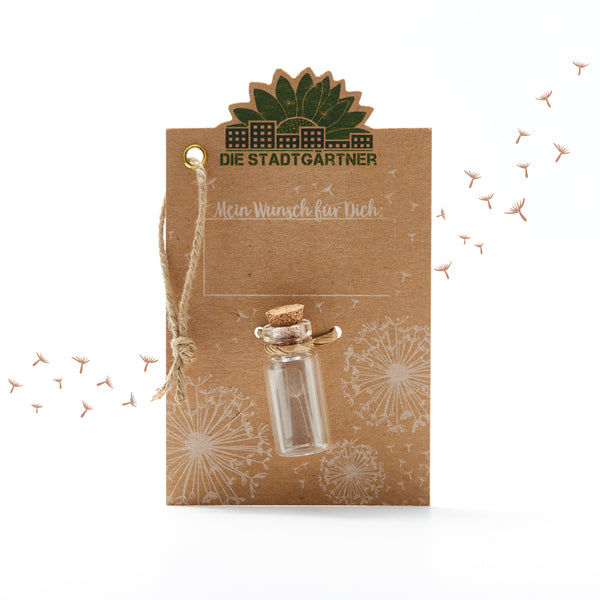 Tarjeta marrón con la inscripción "Los jardineros de la ciudad", una pequeña botella de vidrio y dientes de león ilustrados.