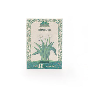 Paquete de semillas de ajo silvestre con decoración verde e ilustración de la planta en el frente.
