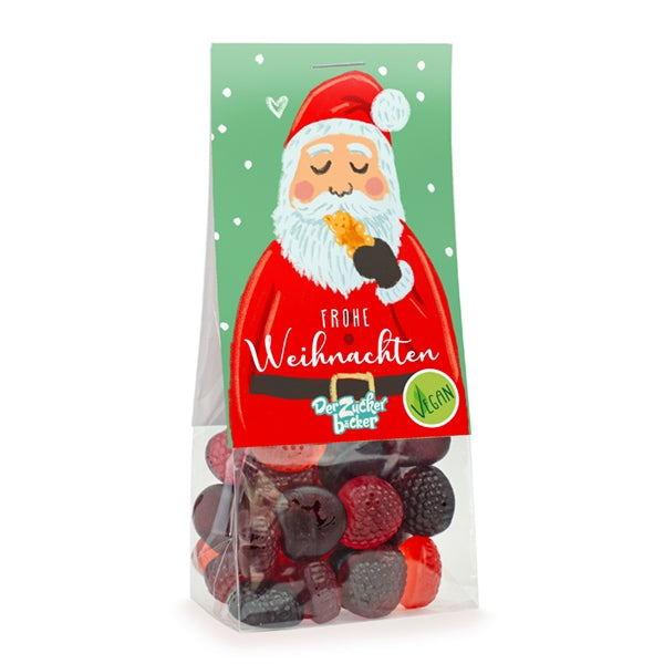 Embalaje con dulces navideños veganos y una imagen de Papá Noel comiendo una galleta con las palabras “Feliz Navidad”.