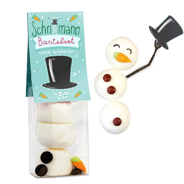 Un kit de manualidades para hacer un muñeco de nieve con trozos de azúcar y un packaging que sirve como plantilla.