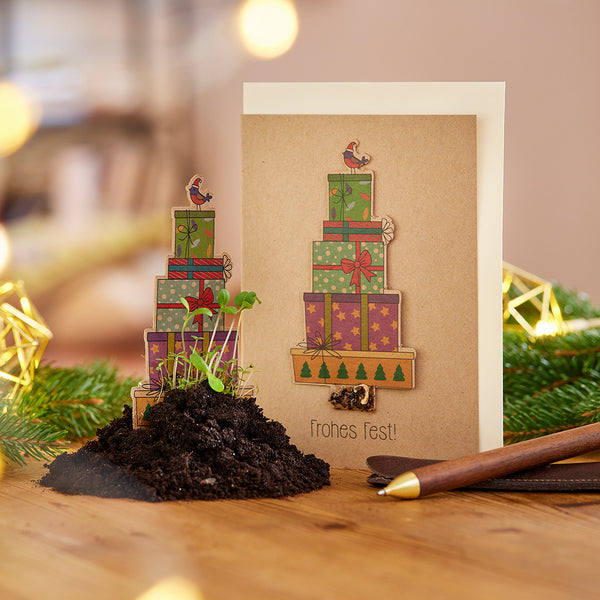 Tarjeta navideña con regalos - texto "Feliz Navidad"
