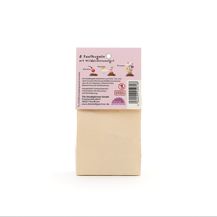 Bolsa de papel marrón con una etiqueta en alemán que describe "8 bolas de semillas con semillas de flores silvestres".
