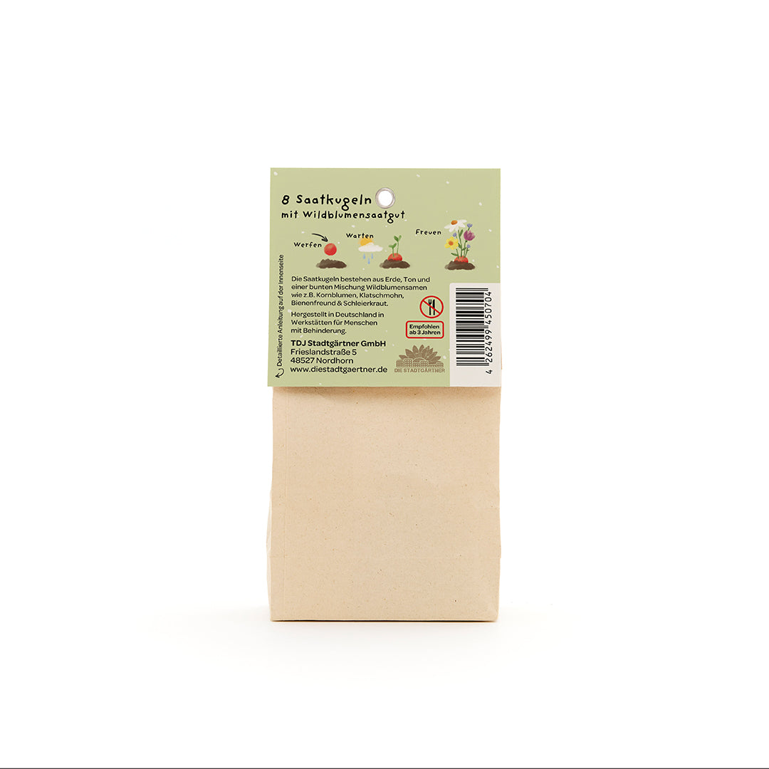 Bolsa de papel con etiqueta verde que muestra información sobre 8 bolas de semillas con semillas de flores silvestres.