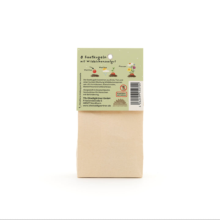 Bolsa de papel con etiqueta verde que muestra información sobre 8 bolas de semillas con semillas de flores silvestres.