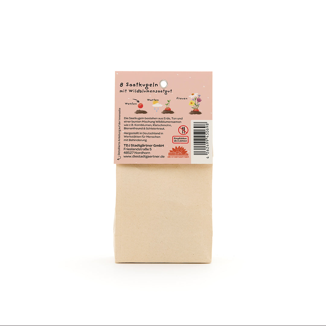 Bolsa de papel con una etiqueta que describe 8 bolas de semillas de flores silvestres, así como información sobre la aplicación e instrucciones del fabricante en alemán.