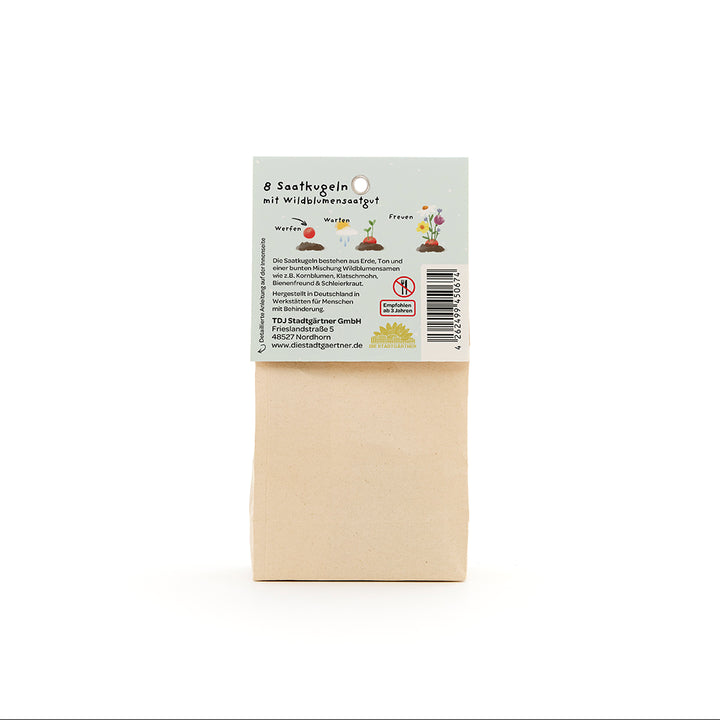 Bolsa de papel con etiqueta para 8 bolas de semillas con semillas de flores silvestres, descrita en alemán.