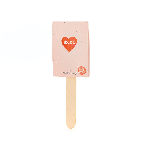 Bolsas de helado de color rosa con un corazón rojo y las palabras "HDGDL" y "Wildflower Seeds" debajo.