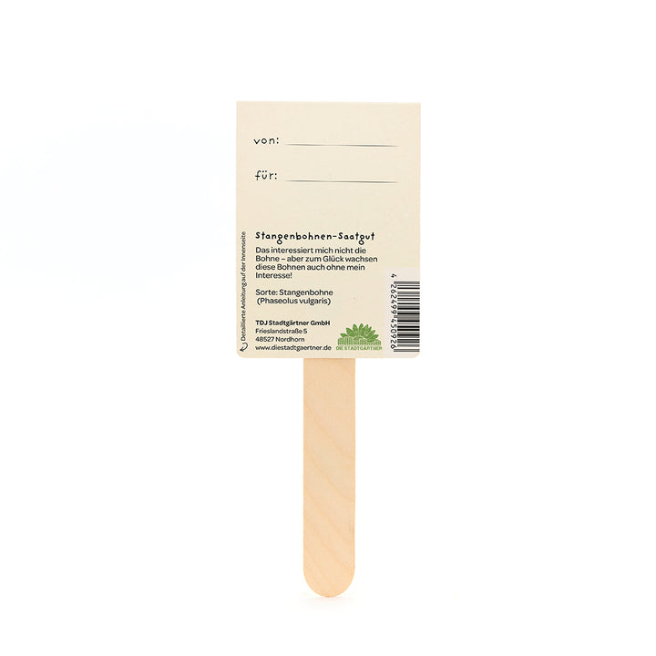 Quédese con un cartel de papel rectangular, con campos de texto "de:" y "para:" e información sobre las semillas de judías verdes en alemán.