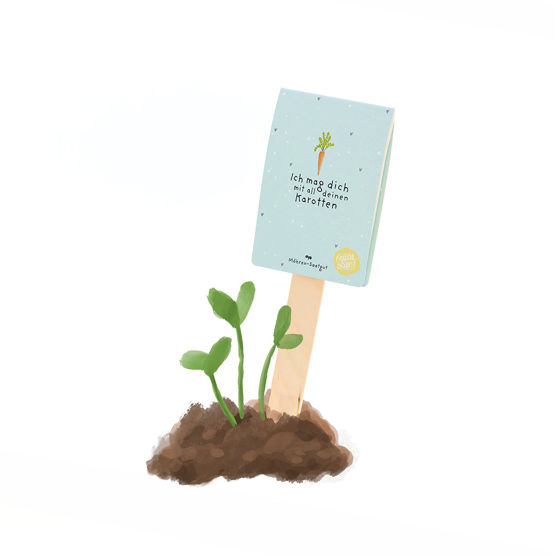 Una pequeña planta verde crece en el suelo, con un cartel al lado que dice "Te amo con todas tus zanahorias".