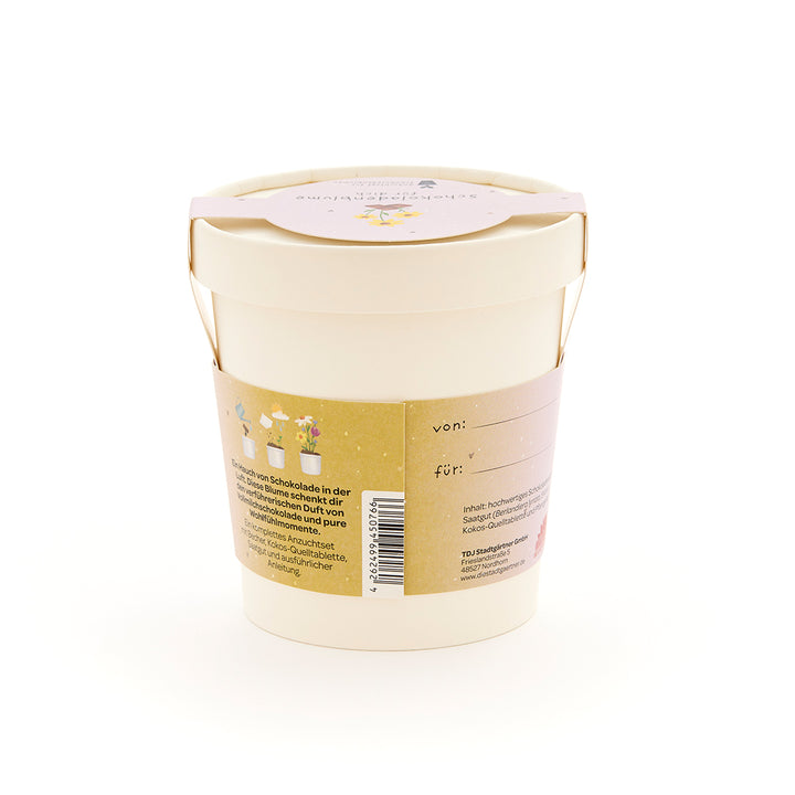 Maceta de color beige con asa marrón y etiqueta con información e ilustraciones.