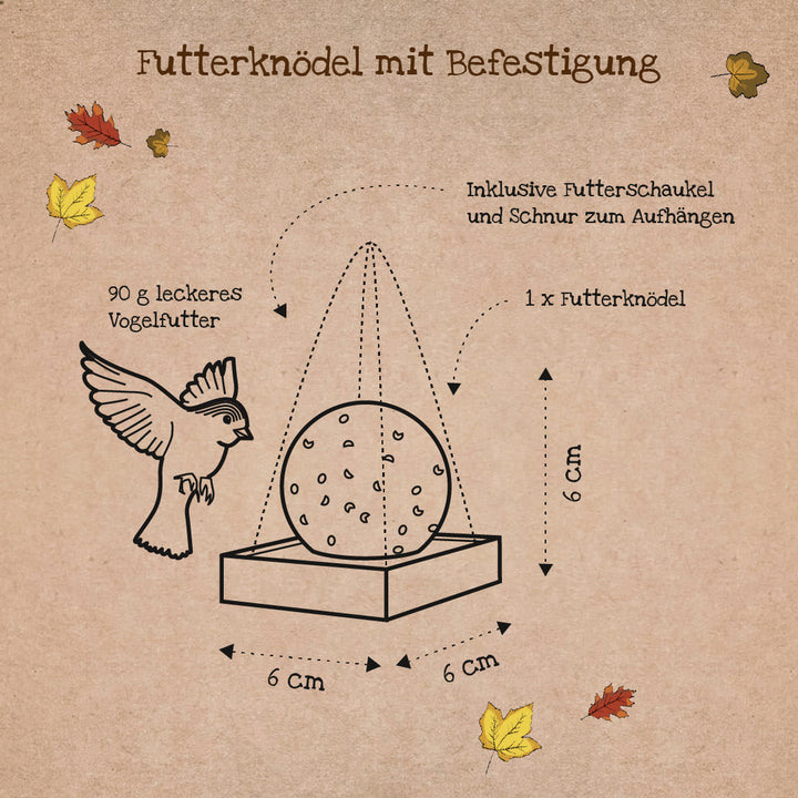 Ilustración de un dumpling de comida con accesorio, dimensiones 6x6x6 cm, incluye pájaro, columpio de comida y cordón para colgar, hojas de otoño en el fondo.