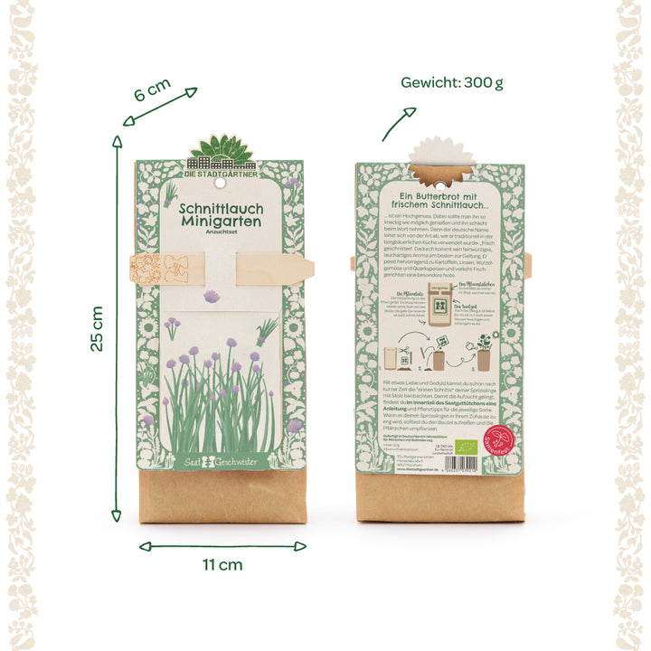 Dos paquetes de un mini kit de cultivo de jardín de cebollino con un patrón floral verde y blanco, dimensiones 25 x 11 x 6 cm, peso 300 g, parte delantera y trasera visibles, información del producto en alemán.