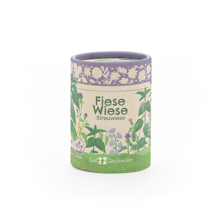 Lata redonda con la inscripción "Fiese Wiese Streuwiese" e ilustraciones florales, producto de SaatGeschwister.