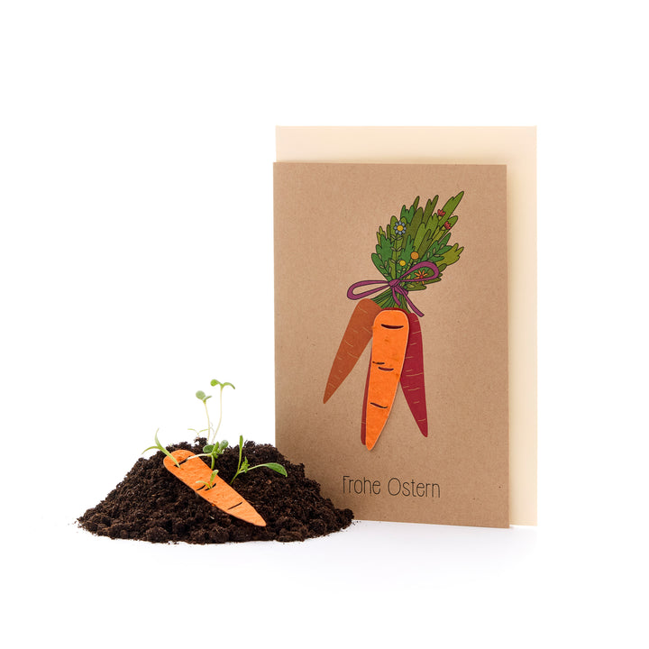 Tarjeta de Pascua con motivo de zanahoria y tierra con semillas de zanahoria, texto "Felices Pascuas".