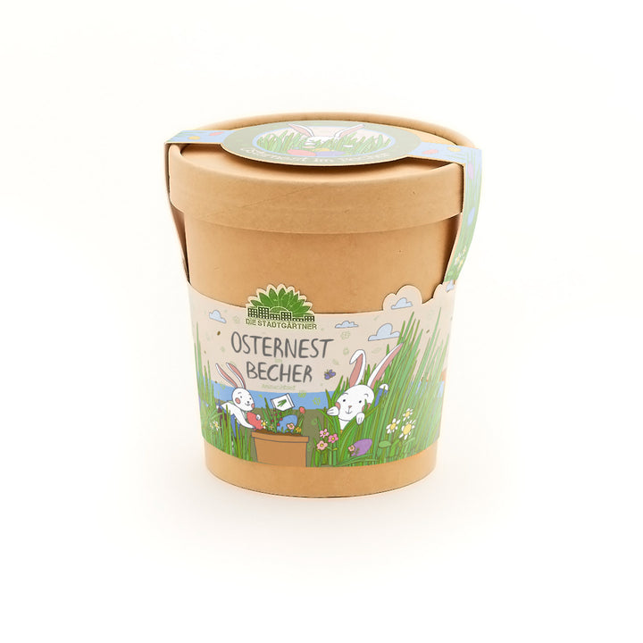 Taza de cartón artesanal con ilustración de conejito de Pascua y la inscripción “Easter Nest Cup” de Die Stadtgärtner.
