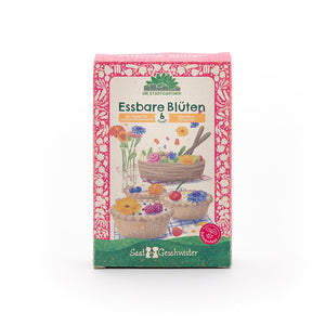 Paquete de semillas "Flores comestibles" de Saatgeschwister, diseñado con colores vivos y ilustraciones de flores comestibles y pasteles.