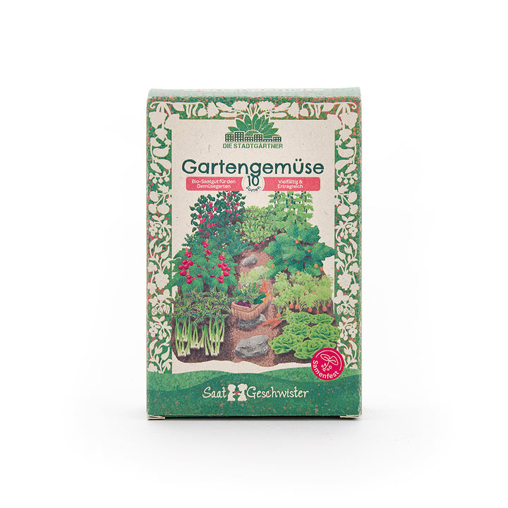 Paquete de semillas de hortalizas orgánicas, ilustrado con varias plantas de hortalizas y un borde decorativo verde.