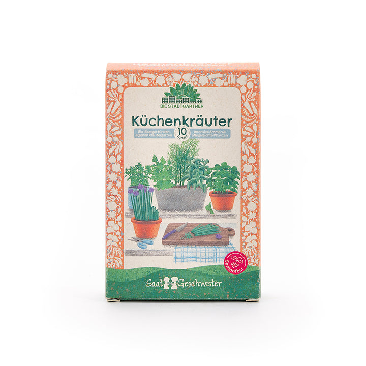 Embalaje para semillas de hierbas culinarias con ilustraciones de macetas de hierbas y una tabla de cortar en el frente.