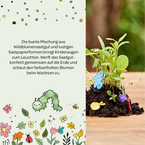 Ilustración colorida con texto sobre semillas de flores silvestres y formas de papel con semillas para niños, junto a una pequeña pila de plantas con coloridas mariposas de papel y flores en el suelo.