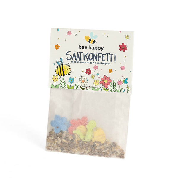 Semillas de flores silvestres y confeti de papel con semillas en una bolsa de celofán