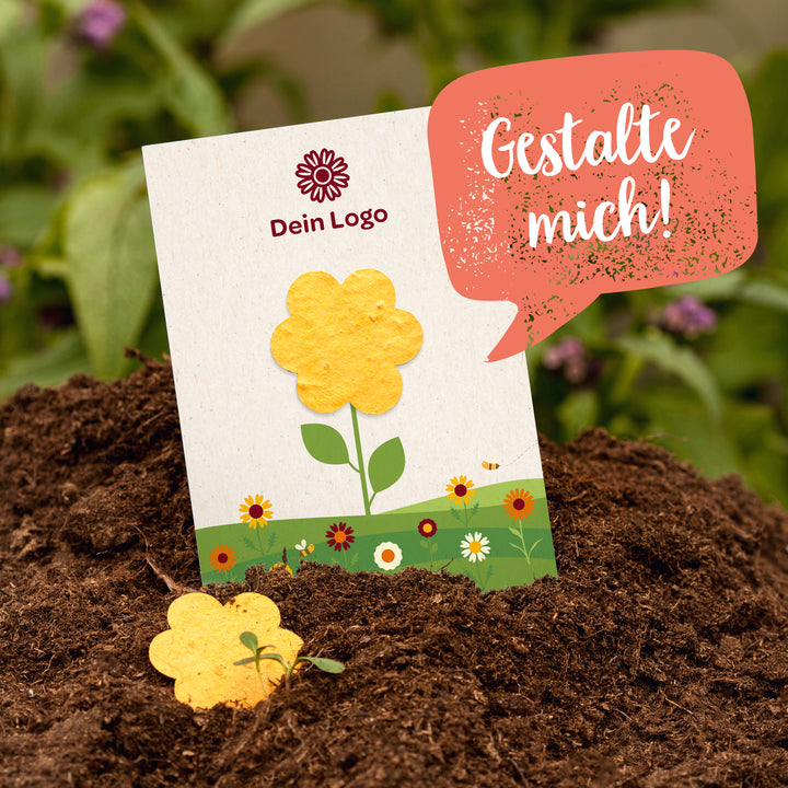 Tarjeta con flor amarilla en macizo de flores, bocadillo de diálogo con “¡Diséñame!”, espacio para logo.