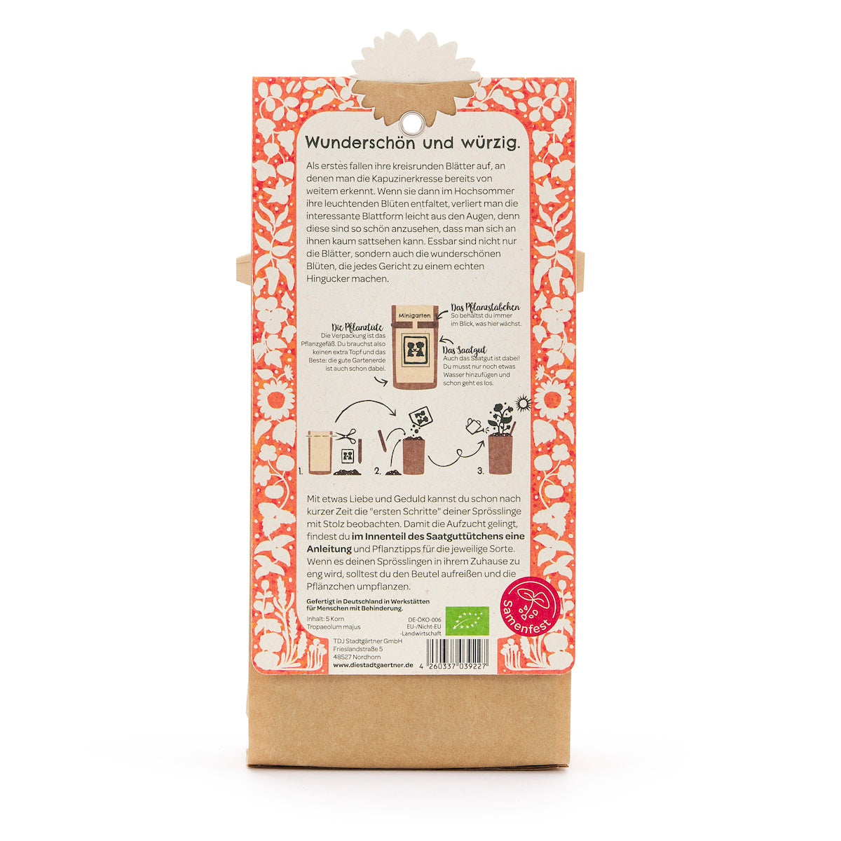 Reverso de un paquete de semillas con descripción en alemán, ilustraciones de siembra y un patrón floral naranja y blanco.
