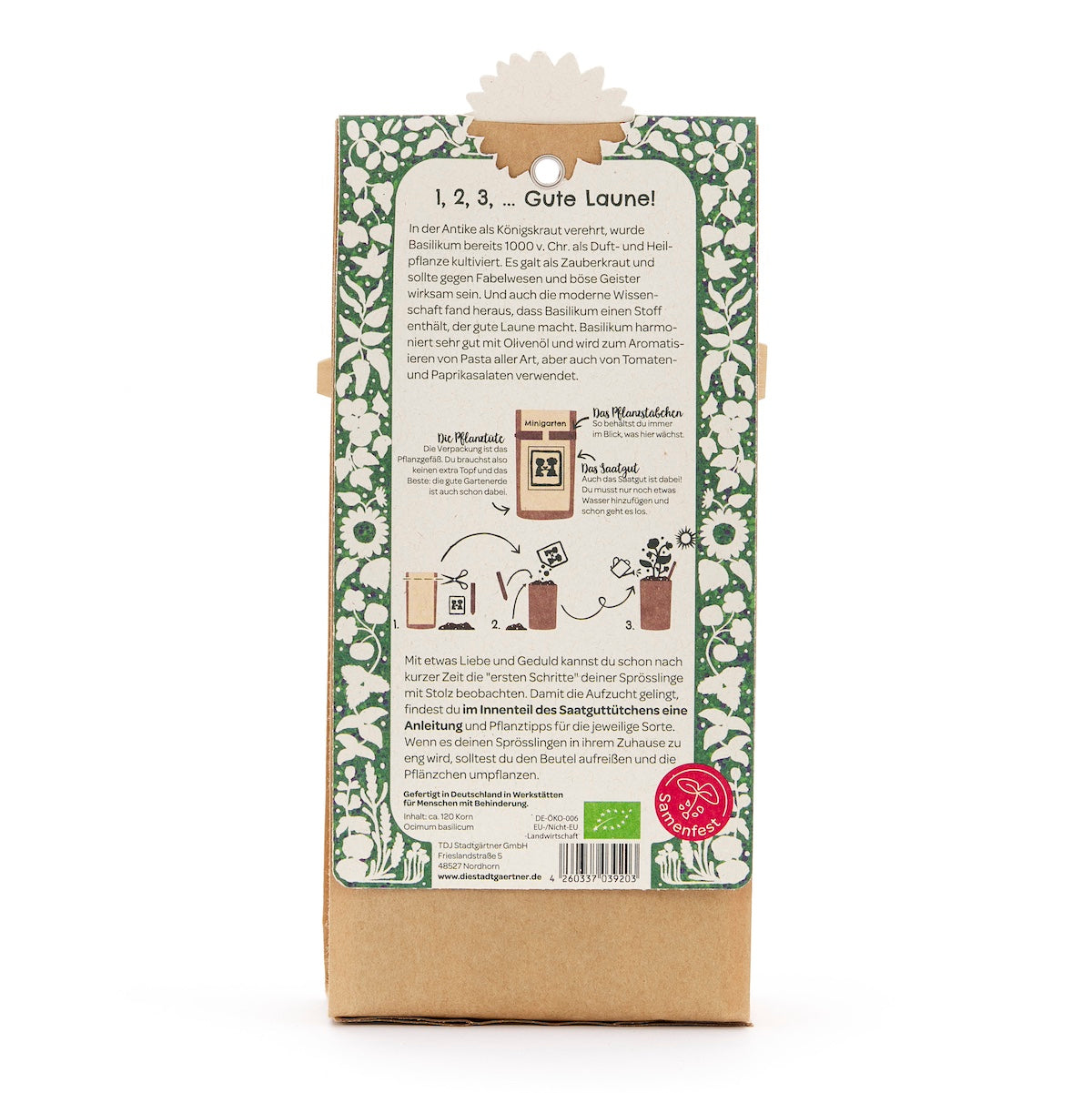 Parte posterior de un paquete con instrucciones en alemán para cultivar albahaca, borde verde decorativo y descripción de texto.