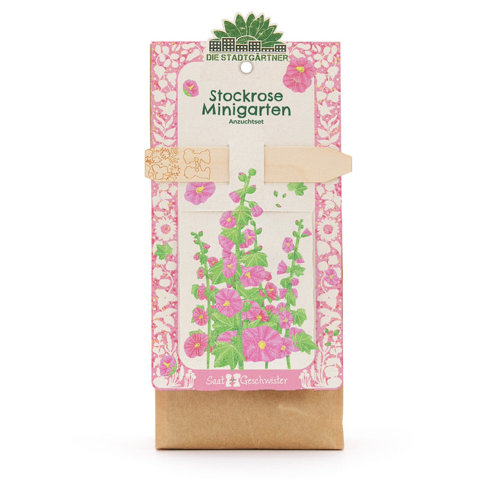 Kit de cultivo de mini jardín de malvarrosa con ilustración de flores coloridas en el paquete.