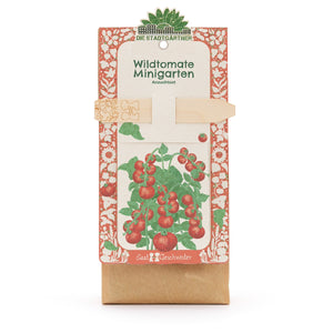 Kit de cultivo “Wild Tomato Mini Garden” de Die Stadtgärtner, embalaje con ilustración de una planta de tomate y tutor de madera.