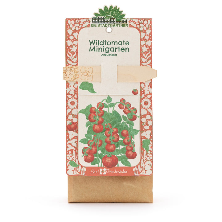 Kit de cultivo “Wild Tomato Mini Garden” de Die Stadtgärtner, embalaje con ilustración de una planta de tomate y tutor de madera.