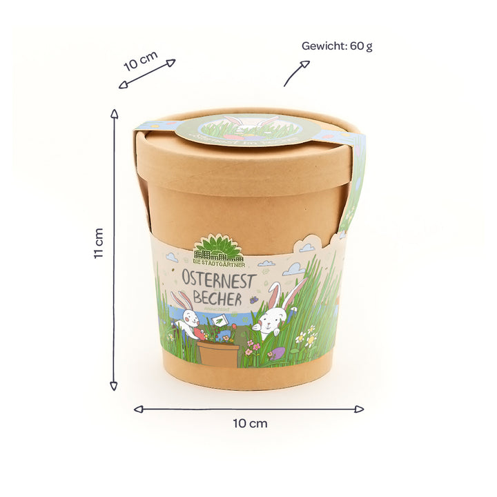 Vaso de papel con diseño de Pascua, inscripción "Easter Nest Cup", dimensiones 10 x 11 cm, peso 60 g, decorado con conejitos y prado primaveral.