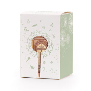 Caja de regalo con motivo de diente de león y billete en forma de piruleta como decoración.