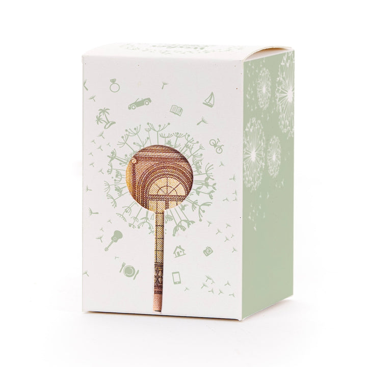 Caja de regalo con motivo de diente de león y billete en forma de piruleta como decoración.