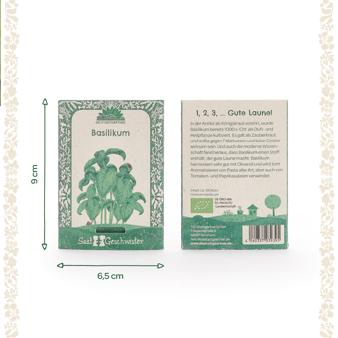 Dos paquetes de semillas verdes de albahaca de la marca "Die Stadtgärtner" con ilustraciones de plantas y dimensiones de 9 cm x 6,5 cm, con texto descriptivo en la parte delantera y trasera.