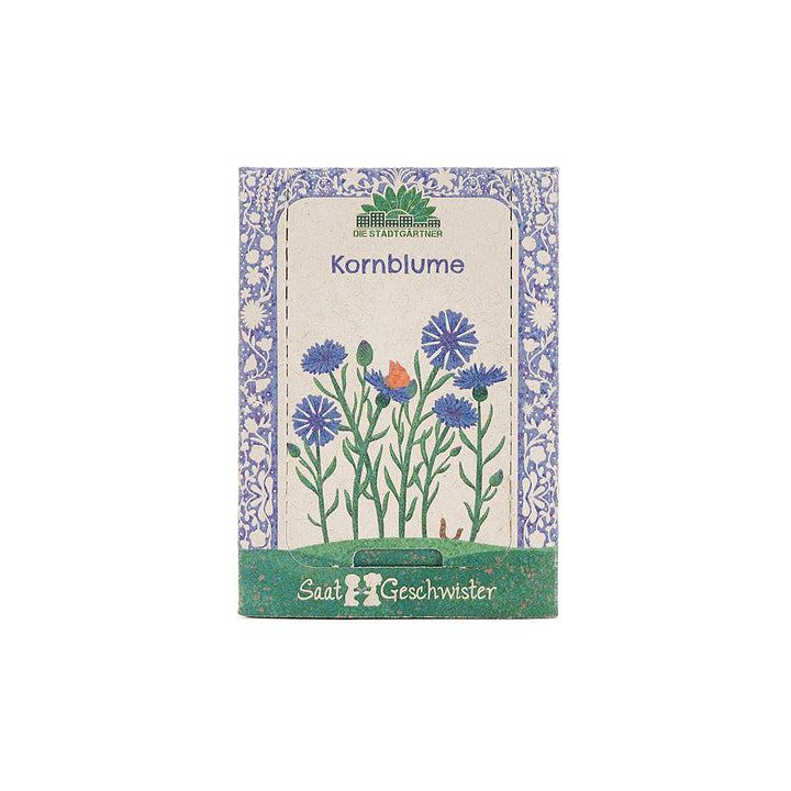 Paquete de semillas de aciano con una ilustración de flores azules en la portada.