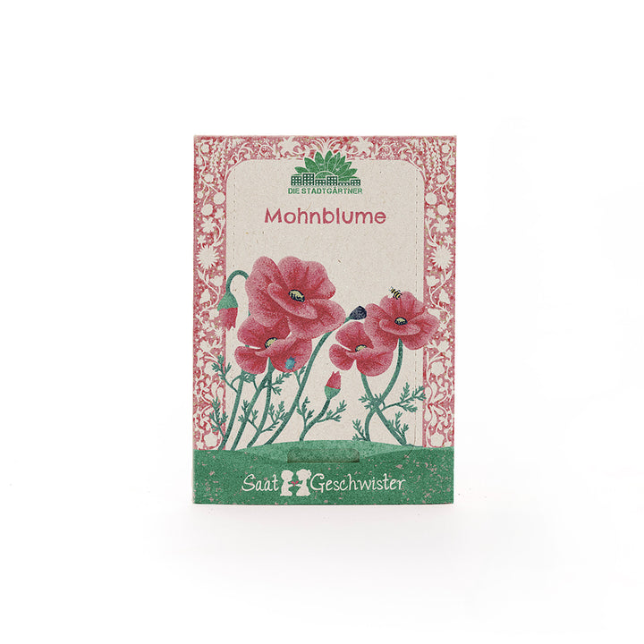 Bolsa de semillas con ilustración de amapolas rojas y la inscripción "Amapola" y "Hermanos de Semillas".
