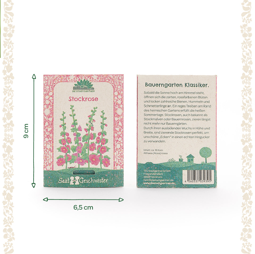 Dos paquetes de semillas de malvarrosa de Saatgeschwister, uno con una ilustración de las flores y otro con una descripción en alemán; dimensiones 9 cm de alto y 6,5 cm de ancho.