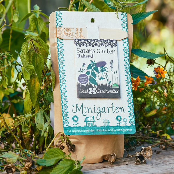 Embalaje de "Saat & Geschwister Minigarten" con la inscripción "Satan's Garden Weeds" en verde.