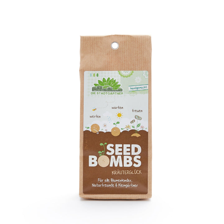 Embalaje de "Bombas de semillas Herbal Happiness" de Die Stadtgärtner, para niños de flores y amantes de la naturaleza.