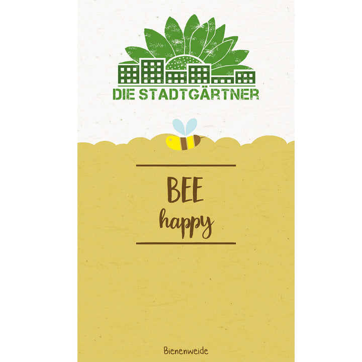 Ilustración con el texto "DIE STADTGÄRTNER BEE happy" y la imagen de una abeja sobre un prado de flores estilizado, con casas y árboles al fondo.